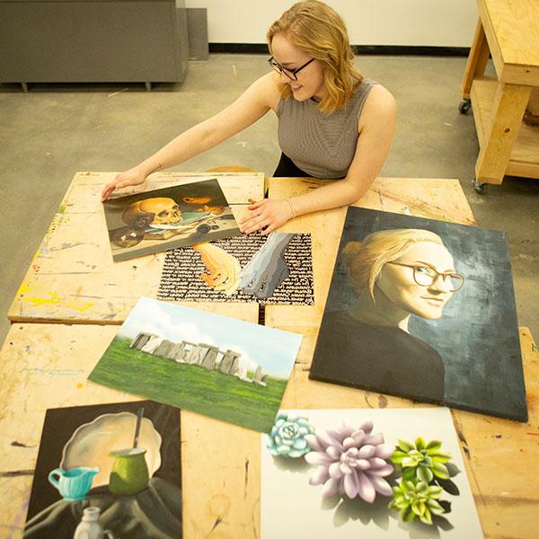 Female student presenting her artwork