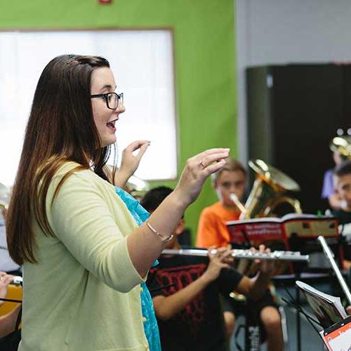 Music Teacher with students